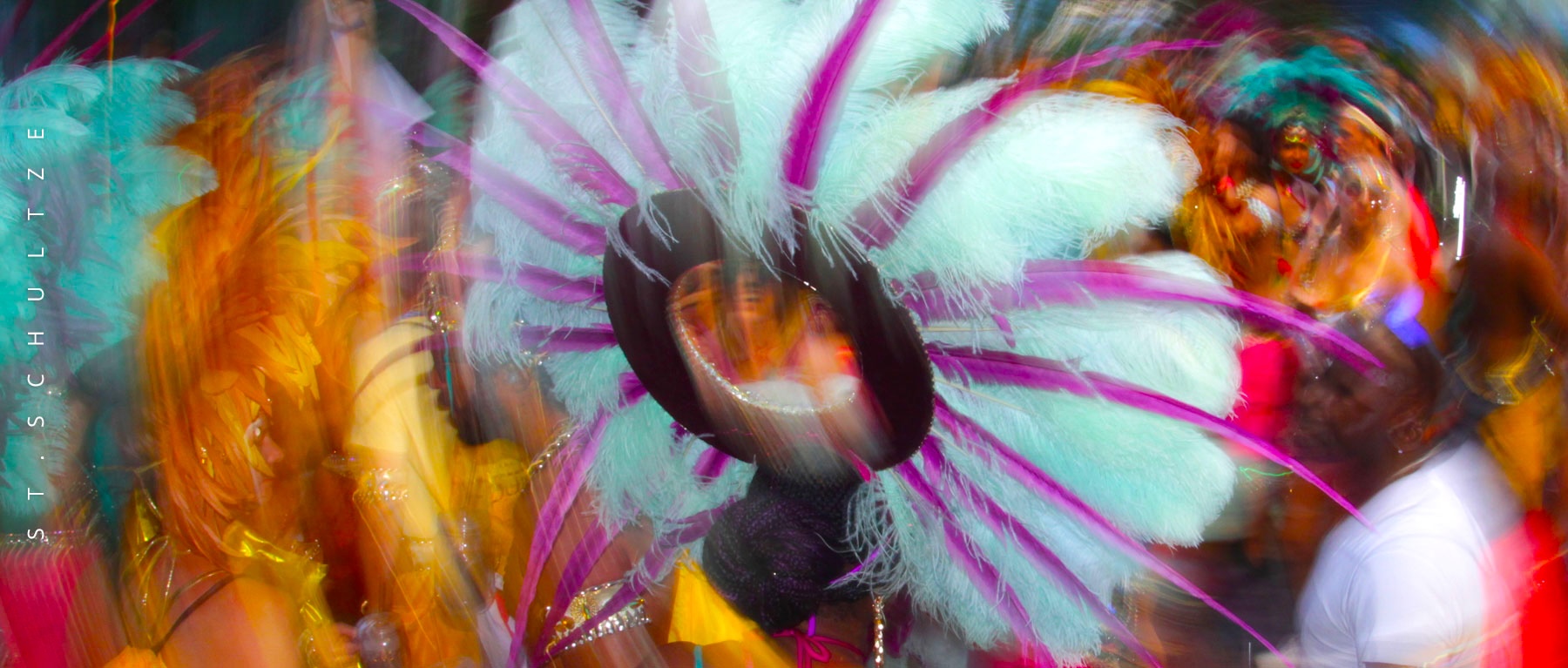 On the streets of Berlin. People come to the city to explore and experience the culture. Events like the Carnival of the Cultures literally draw millions of tourists to the city. Folks go home with memories for life and the healing power of music. Photographed by St.Schultze.
